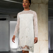 Long sleeved web and lace white knee-length dress